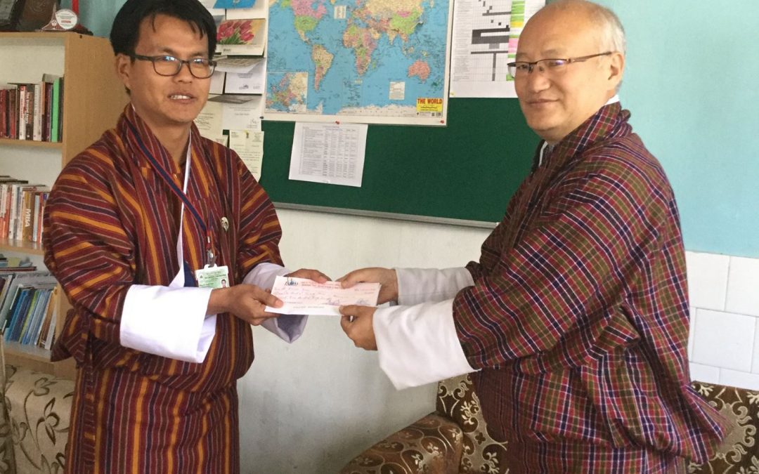 Dr. Karma Tenzin, Dy. Dean, FPM, KGUMSB receiving the Research Grant from the Hon’ble President